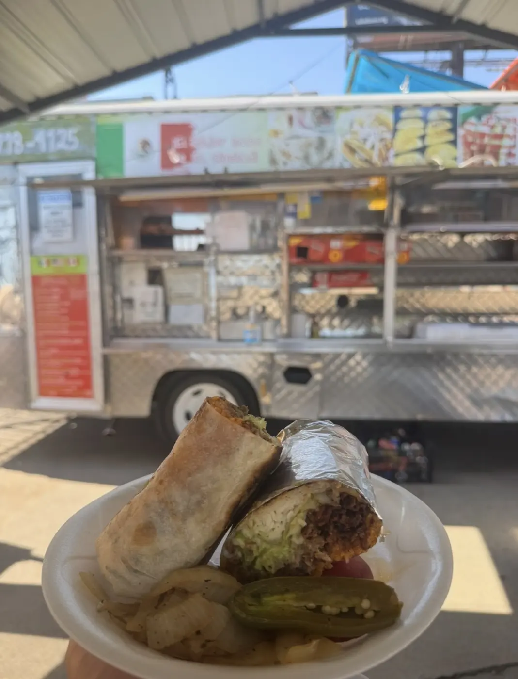 Loaded burrito served in front of the Taco Fiesta truck