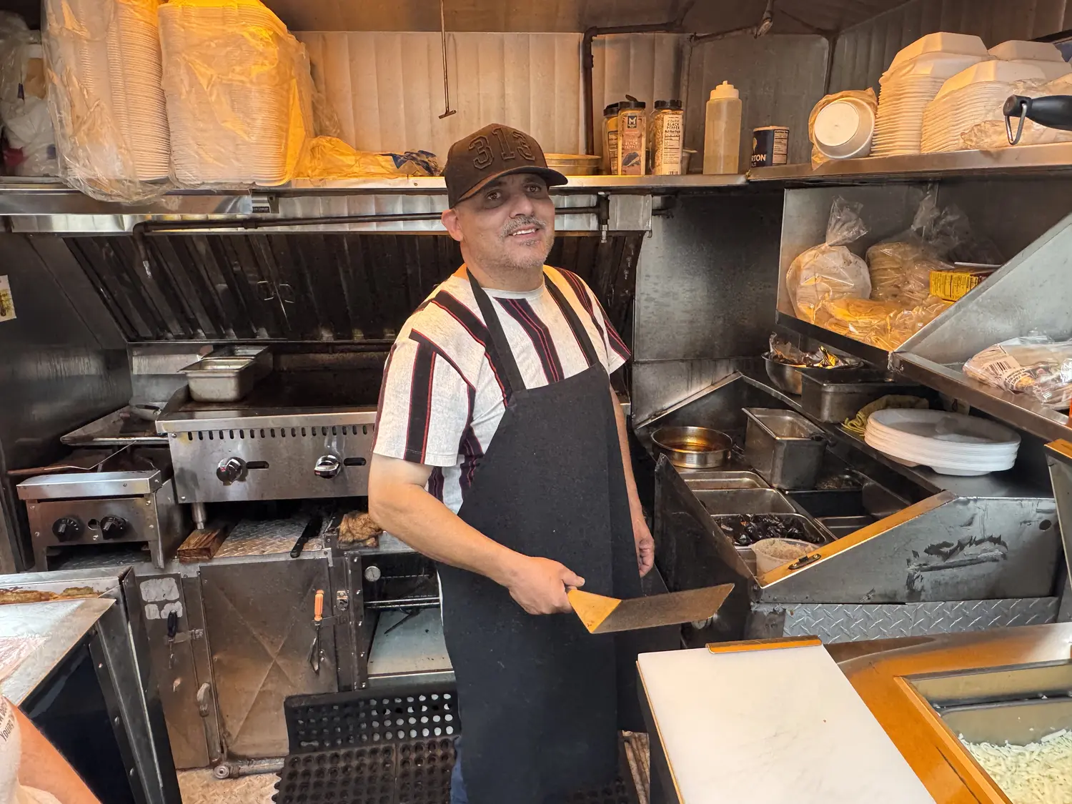 The owner of Taco Fiesta inside the food truck